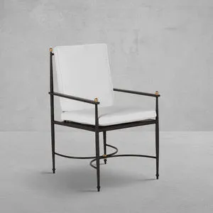 Roma Wrought Aluminum Arm Chair with white cushions, black wrought aluminum frame, and gold accent finials