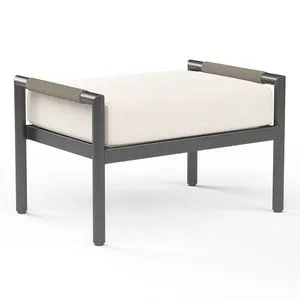Pietra Ottoman in matte graphite aluminum frame with rounded tube legs and off-white cushioned top