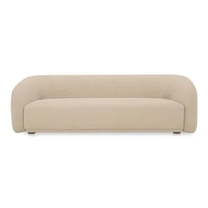 Faye sofa with curved back, firm bench seat, petite rounded legs, upholstered in beige exaggerated boucle fabric