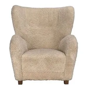 Front-facing Pola Chair highlighting wide backrest and woolly texture