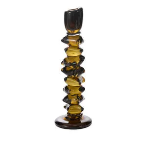 Chunky stacked glass candleholder with sculptural shapes in dark green translucent glass