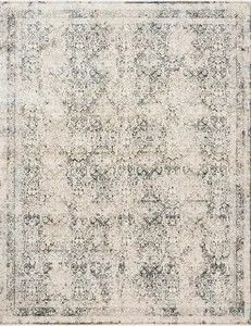Theia Natural Ocean Rug with muted neutral tones and blue-gray distressed pattern and fringe border