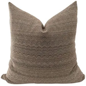 square pillow with textured brown cover featuring subtle chevron pattern in warm cocoa tones