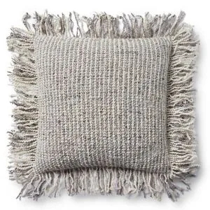 Square beige pillow with wool and cotton blend fabric and fringe trim on all sides