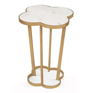 Clover-shaped side table with creamy white marble top and natural brass steel frame