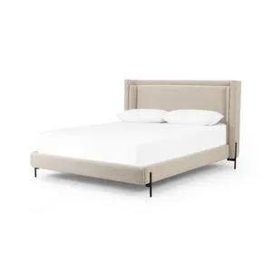 Dobson Bed with shelter-style upholstered headboard in beige textured fabric and gunmetal iron cradle legs