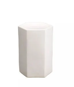 Small white ceramic side table with geometric hexagonal shape and smooth glossy finish