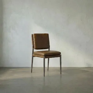 Industrial dining chair with steel gray powder coat frame and top-grain Ebony Black leather seat and back