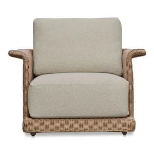 Meredith Outdoor Accent Chair with tulip silhouette, woven synthetic wicker over aluminum frame, and beige cushioned seat ...