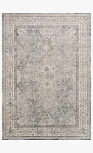 Vintage style Teagan Sky natural rug with intricate faded floral medallion design in soft blue and beige tones