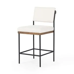 Three-quarter view of Benton Stool showing square metal frame with footrest and wood trim under seat