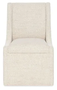 Front view focusing on the wide seat cushion and slight flare of the track arms in beige upholstery.