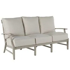 Three-seat outdoor aluminum sofa with beige cushioned seats and backrests, open armrests, and sturdy legs