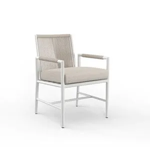 Sabbia Dining Chair with satin white aluminum frame, natural all-weather rope back, and beige cushioned seat