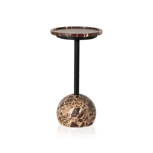 Viola Merlot Marble Round Accent Table with merlot marble top and spherical marble base connected by a slender black metal...