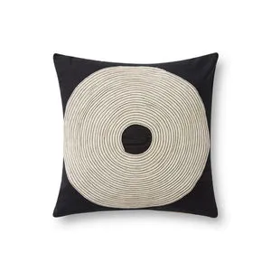 Square black pillow with an embroidered natural-colored concentric circle design featuring a hollow center