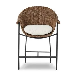 Outdoor counter stool with curvy woven frame, rolled arms, black iron base, and cream upholstered cushion
