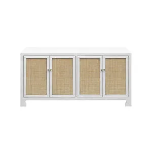 Sofia Cabinet with matte white frame and natural hand-woven cane front panels with brass knobs