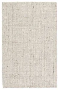 Solid cream and tan handwoven wool rug with basket weave texture, rectangular shape