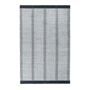 Black and white striped handwoven jute blend area rug with minimalist geometric black bands