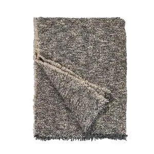 Steel blue Brentwood Throw with textured weave and fringed edges, folded with corner turned