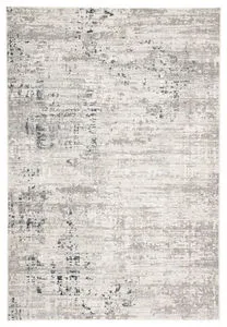 Abstract modern area rug in neutral gray and ivory tones with subtle carved texture and sheen