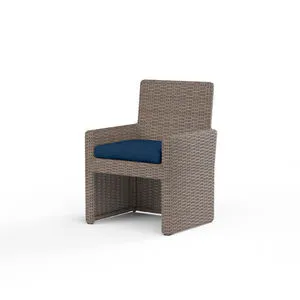 Coronado Dining Chair with resin wicker finish in Driftwood and navy blue plush cushion