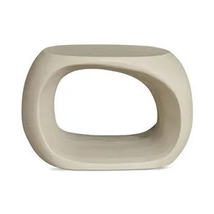 Sculptural Albers Outdoor Stool in curved beige concrete with hollow center and smooth finish