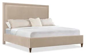King upholstered bed with soft beige velvet fabric, wood tapered legs, and welt trim on headboard and footboard