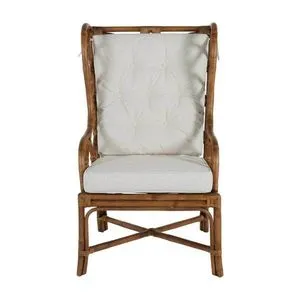 Front view showing tufted linen back cushion and geometric rattan framing on antique wooden legs