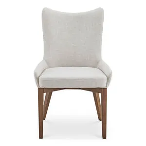 Posta dining chair with high curved back, padded seat in light beige fabric, and tapered walnut rubberwood legs