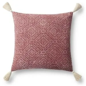 Square red pillow with white woven geometric pattern and cream tassels on each corner
