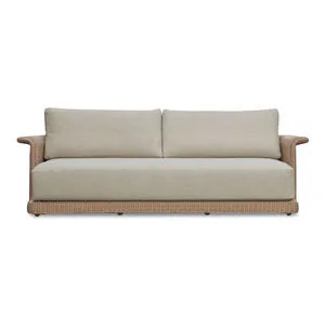 Meredith outdoor sofa with curved armrests, beige cushions, and woven synthetic wicker base