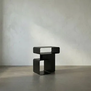 Matte black iron Danville Side Table with minimalist curved rectangular forms stacked asymmetrically