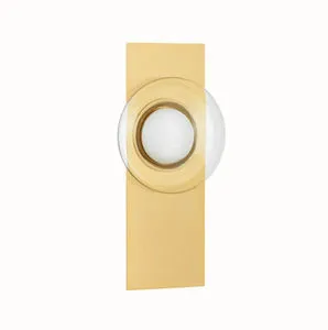 Pound Ridge Wall Sconce angled side view emphasizing slim aged brass backplate depth