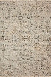 Overhead view showing full patterned design with symmetrical intricate floral and geometric motifs in muted tones