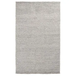 Handwoven 5 by 8 foot wool blend area rug in feather gray with plush braided texture