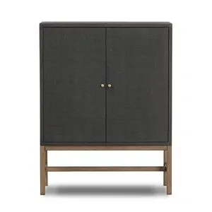 Fiona Bar Cabinet with black woven raffia front, antique brass hardware, and solid mahogany open base