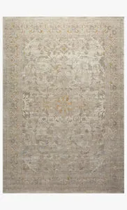 Ivory and natural traditional rug with subtle floral medallion pattern and muted warm beige accents