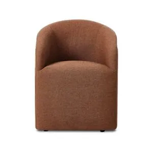 Rhett Dining Chair in rust fabric with barrel-style curved back and fully upholstered body, compact size for small spaces.