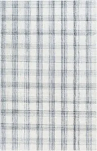 handwoven geometric rug with a black and white plaid pattern made from recycled PET yarn