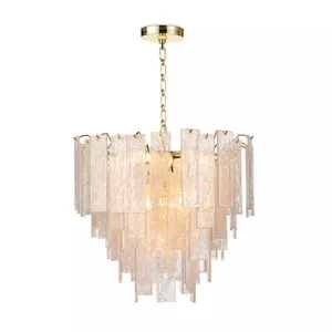 Large Glacier chandelier with layered water glass panes and gold metal frame emitting a soft warm glow