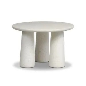 Round outdoor nesting coffee table in cast concrete with three tapered pedestal legs and bullnose edge top