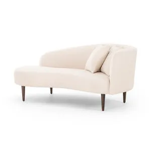 Curvy Italian-inspired right chaise in ivory boucle with dual pillows and tapered brown oak legs