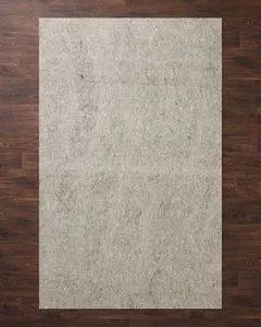 Beige rug pad with 3/8 inch thickness, textured surface, ideal for use under rugs on hard floors or carpet