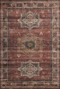 Anniston Spice / Multi traditional area rug with distressed, saturated red and blue geometric motifs on a warm textured ba...