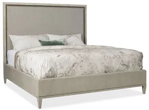 King-sized bed with a tall, neutral upholstered headboard and gray-beige walnut veneer frame and rails