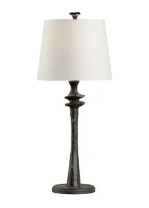 Tall table lamp with a dark bronze hammered iron base and a white tapered fabric shade