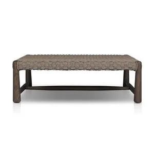 Square outdoor coffee table with chunky taupe box weave top and exaggerated tapered wooden legs