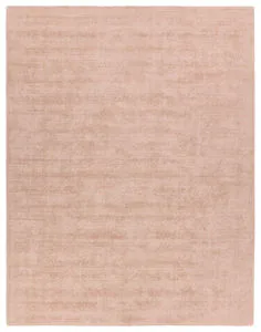 Handwoven Arcus solid blush rug with cut and loop pile and subtle luster in a soft pink tone